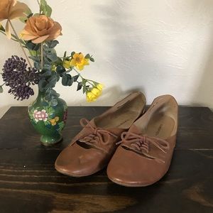 Brown tie-up flats
